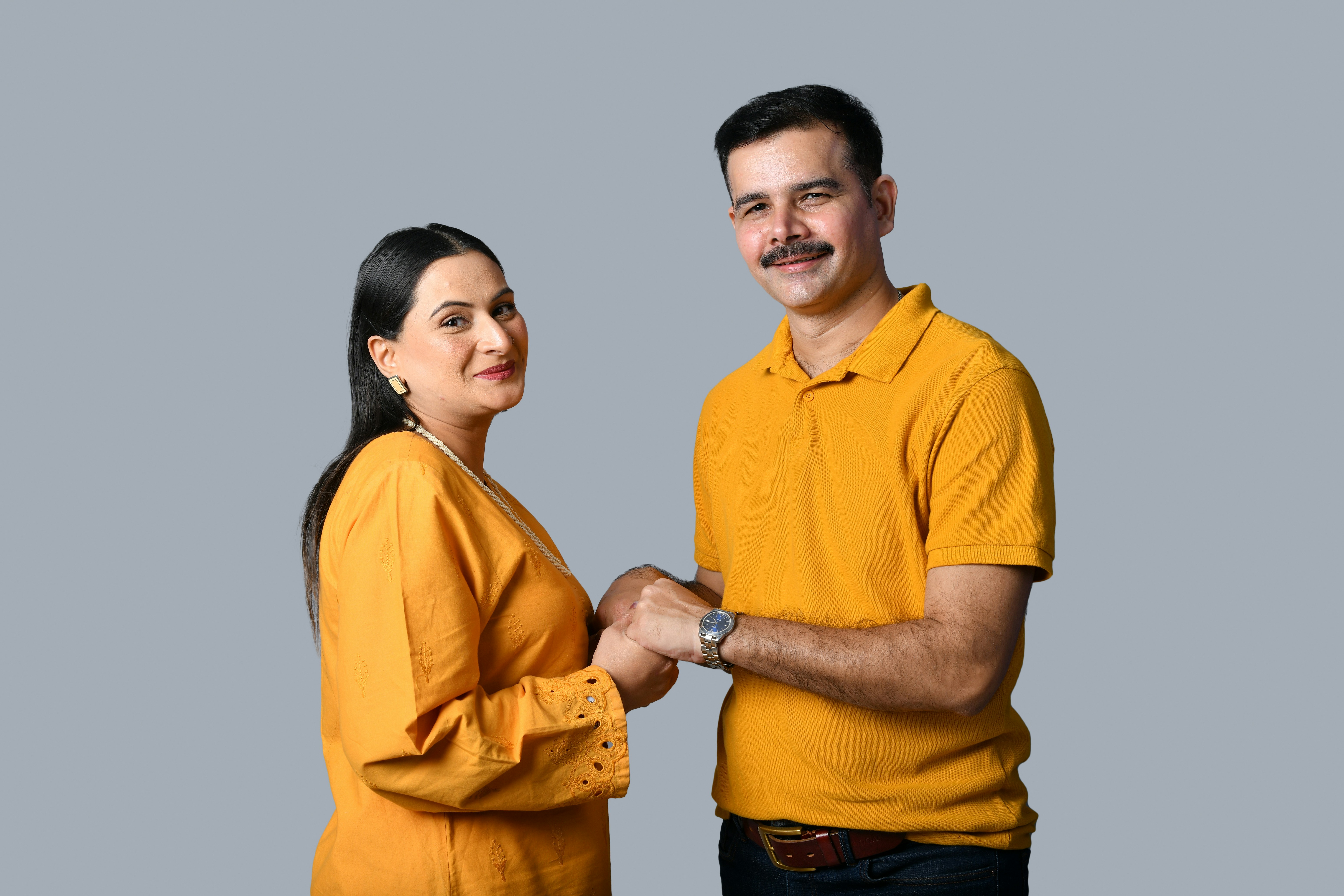 a man and woman holding hands